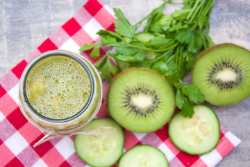 Naklejka na ściany i meble Green smoothie with cucumber, kiwi and apples