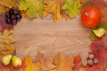 Autumn leaves frame with wood background