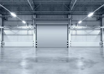 Light filtering roller blinds Industrial building Roller door or roller shutter inside factory, warehouse or industrial building. Modern interior design with polished concrete floor and empty space for product display or industry background.