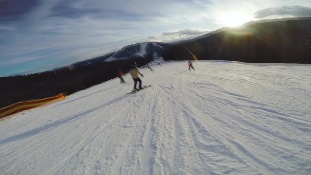 Skier on piste in high mountains