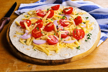 Flat tortilla with cheese and vegetables