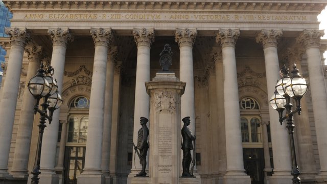 Tilt down the facade of the Royal Exchange building in central London. Shot in 4K