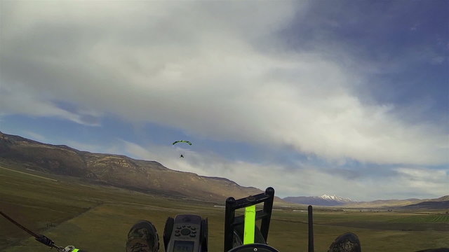 Aerial ultralight powered parachute flight towards mountain HD 0186