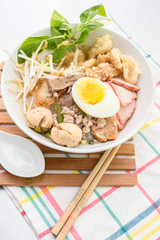 Pork rice noodle soup with meat ball, egg and vegetable