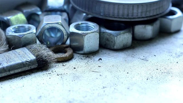 Wrenches and bolts on table close up