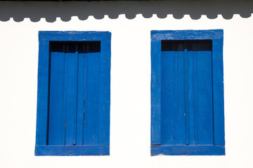 Blue wooden windows on farm house