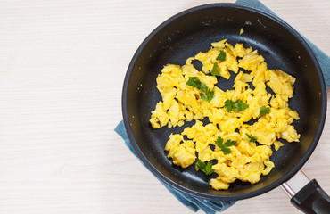 Scrambled egg in a frying pan.