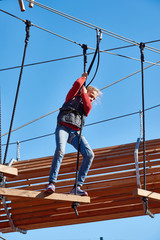 Girl is climbing to amusement park