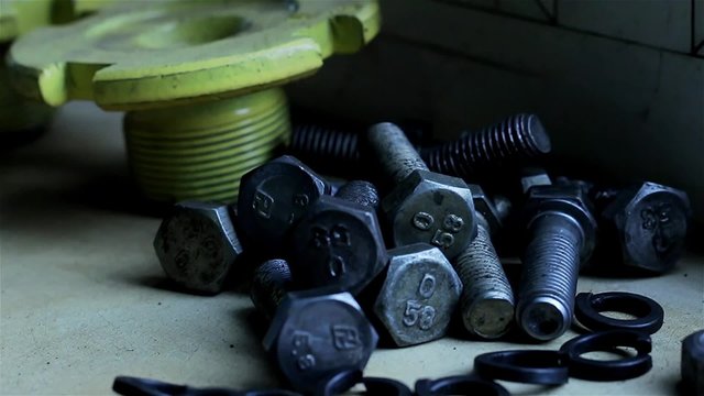 Wrenches and bolts on table close up