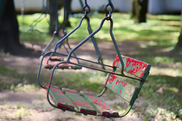 Old swing set on the woods