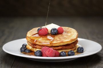 Pancakes with raspberry, blueberry and maple syrup