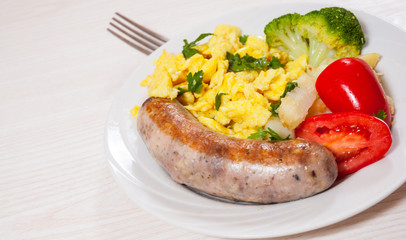 Scrambled egg with sausage and vegetables