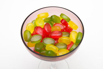 heap colors candy in glass bowl