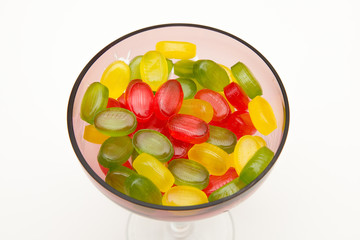 heap colors candy in glass bowl