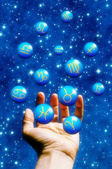 Fototapeta premium hand juggling astrology signs