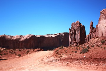 Thunderbird Mesa left and the Hand of God in Rain God Mesa right, Monument Valley Navajo Tribal...