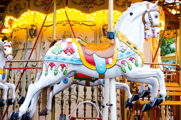Fototapeta na wymiar Vintage merry-go-round wooden horses