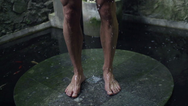 Man standing under shower, super slow motion, 240fps
