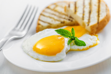 Fried Eggs on plate, food for breakfast