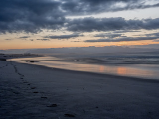 Fototapeta na wymiar Picturesque sunrise on False Bay beach in South Africa - 4