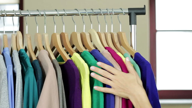 Woman's hand smoothing a colorful clothes
