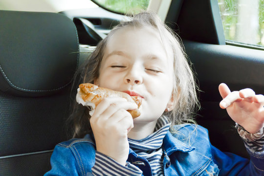 Eating Cute Girl Sitting Inside Car