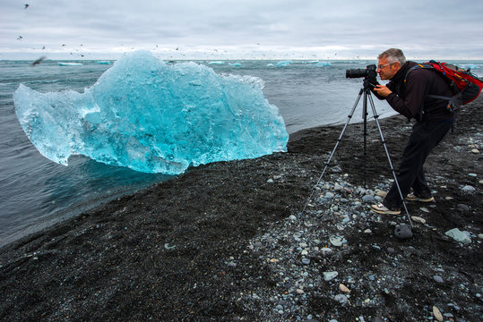 Phoyographer at Jokulsarlon glacier lagoon, Iceland