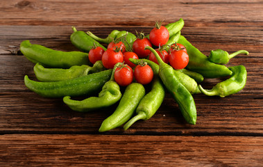 peppers oxtail with tomatoes and garlic on wooden table