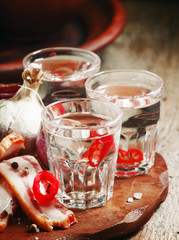 Vodka with spicy red pepper, bacon and garlic, Russian tradition