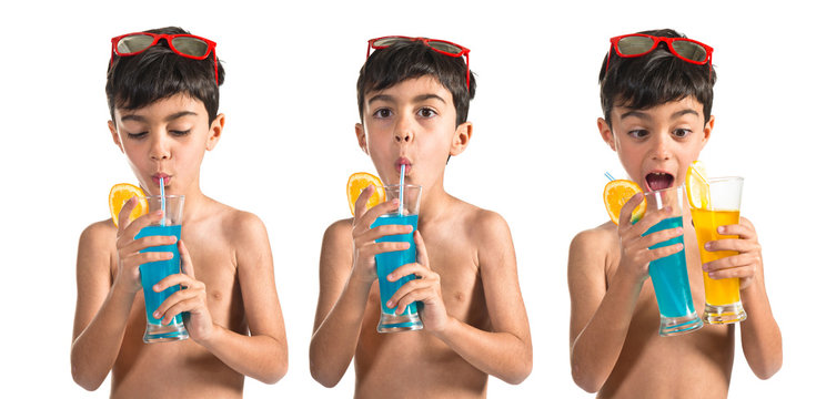 Child drinking blue beverage