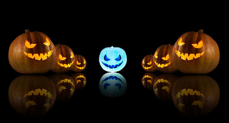 Halloween pumpkins on the dark background.