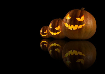 Halloween pumpkins on the dark background.