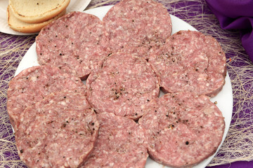 Raw meat with peppers for burgers