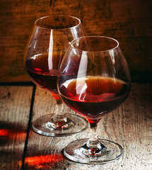 Two glasses of cognac, selective focus