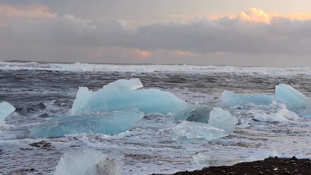 The waves beating on the Iceberg on the black beach, global worming, majestic nature of Vatnajokull Jokulsarlon, Iceland. Full HD Video 1920x1080	
