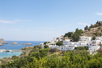 Fototapeta na wymiar The white houses of Lindos in Rhodes island