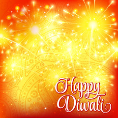Happy Diwali festival of lights. Fireworks on orange ornamental background