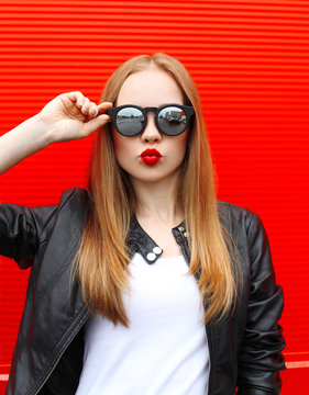 Fashion portrait pretty blonde woman with red lipstick wearing a