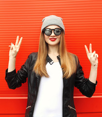 Fashion stylish cool girl having fun wearing a rock black leathe