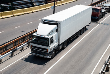 White truck on road. Cargo transportation