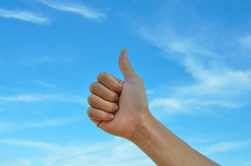 good hand gesture close up with blue sky