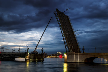 Fototapeta na wymiar Views of diluted Troitsky bridge in St. Petersburg at evening il