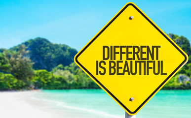 Different is Beautiful sign with beach background