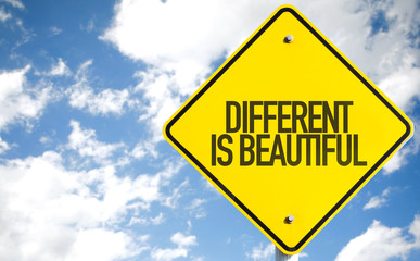 Different is Beautiful sign with sky background