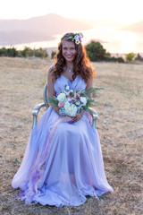 Fototapeta premium Attractive bride is holding a wedding bouquet