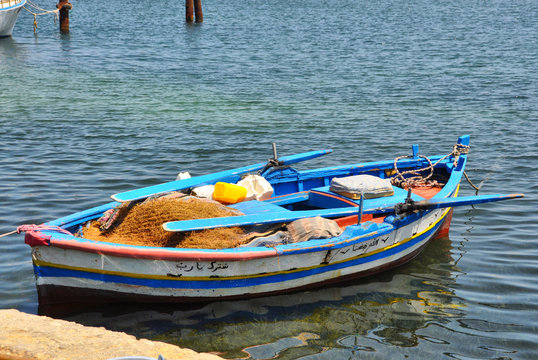 Colorful fishing boats moored on the shore, Tunisia