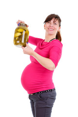 Happy and smiling pregnant woman nine months in trousers and  red blouse. Holds in hands a glass jar with pickles On white isolated background, Positive human emotion, facial expression