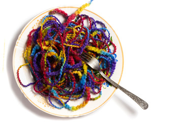 Full plate of melange yarn with a fork