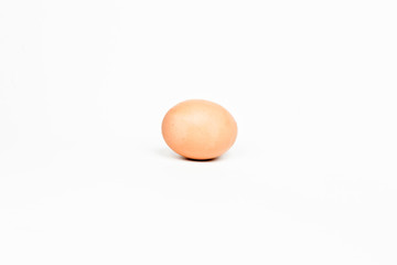 Brown egg isolated on white background