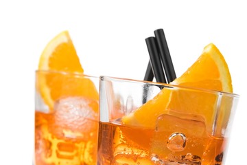 detail of two glasses of spritz aperitif aperol cocktail with orange slices and ice cubes